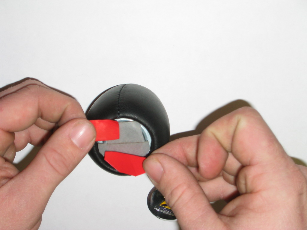 Use the included double sided adhesive tape or another adhesive of your choice.
